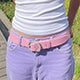 A female customer is wearing a Barbie Pink Classic leather belt with lilac trousers.